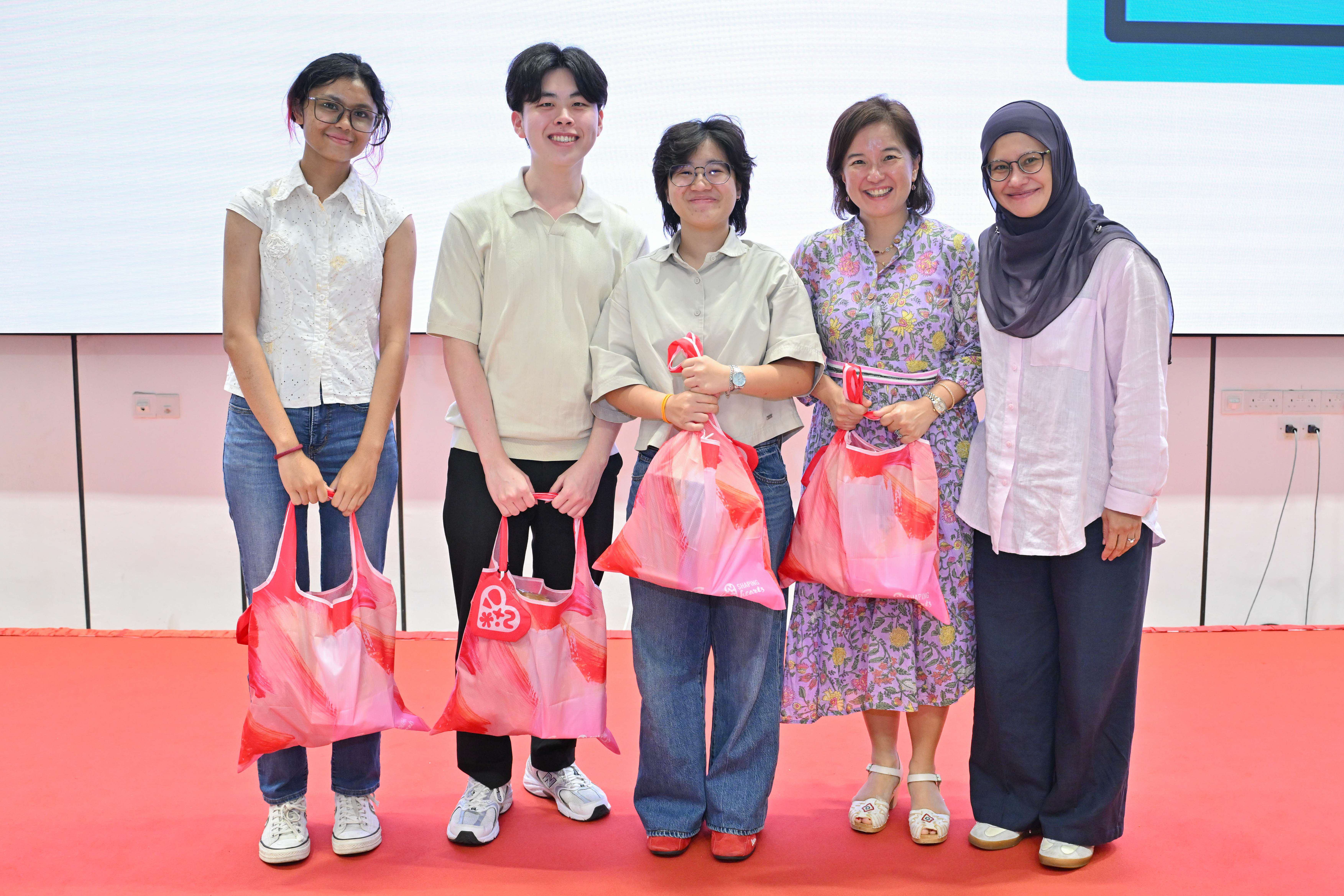 Excited winning students with the judges